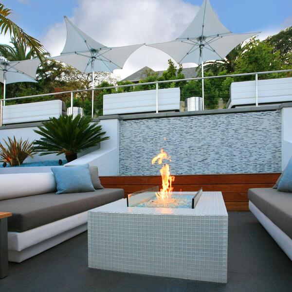 Custom Tiled Wall And Fire Pit With Lounge Seating